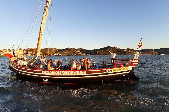 A traditional wooden boat on the Tagus at sunset